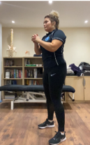 A person standing in a room  Description automatically generated