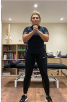 A person standing in a room  Description automatically generated