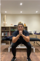 A person standing in a room  Description automatically generated
