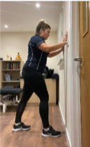 A person standing in a room  Description automatically generated