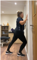 A person standing in a room  Description automatically generated